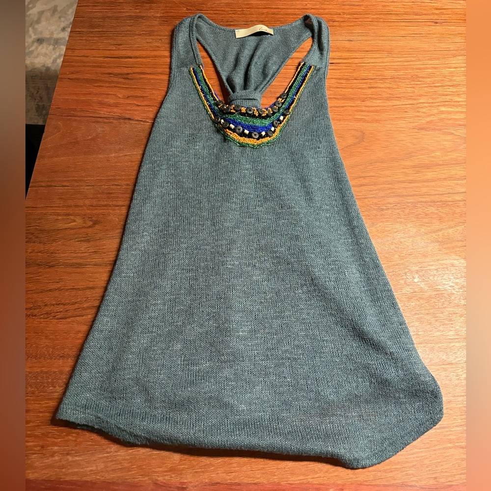 Real knot tank with bead feature in front and knot in the back